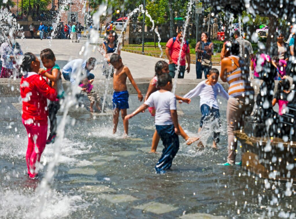 Children playing in fountain at Alameda Central, Mexico City